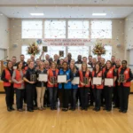 Celebrating Local Heroes: Over 1,000 Community Awards Distributed Diverse community members proudly displaying their well-deserved awards at a local celebration event.