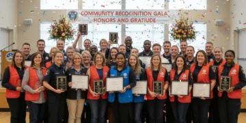 Diverse community members proudly displaying their well-deserved awards at a local celebration event.
